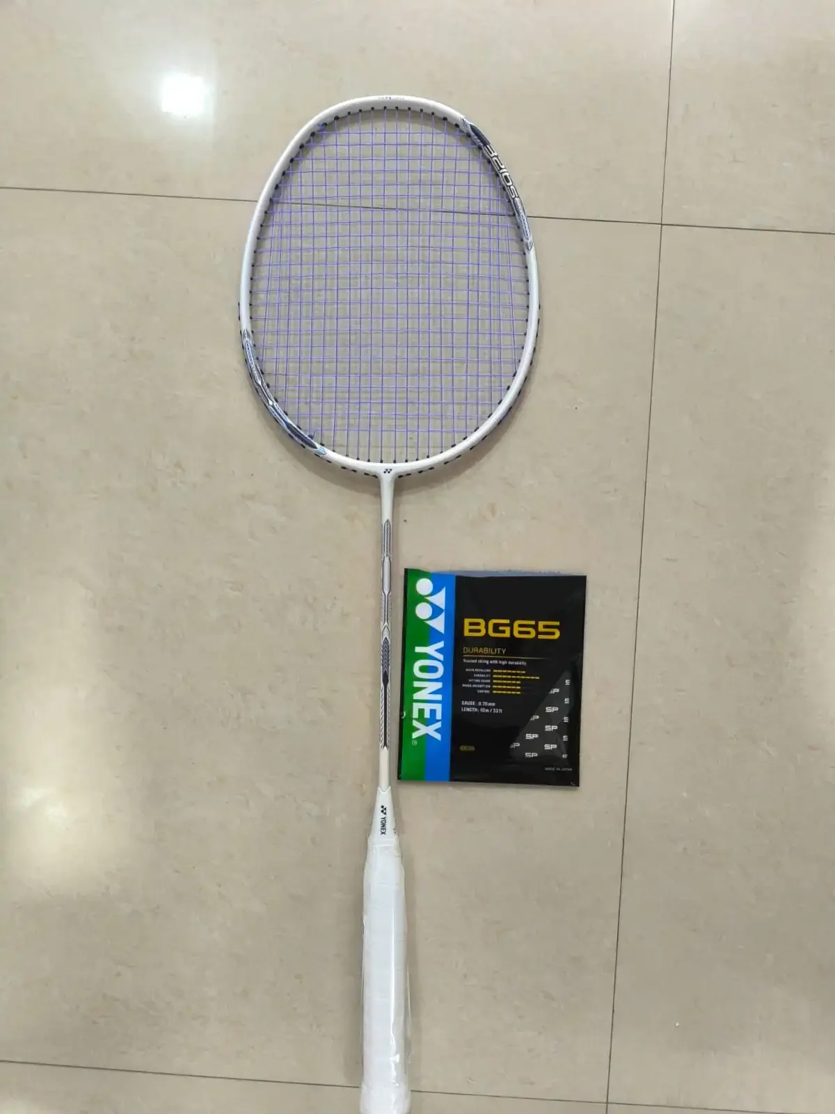 Explore the Yonex Astrox Attack 9 with BG65 strings: head-heavy design, power potential, control, speed, smash response and real racket photos