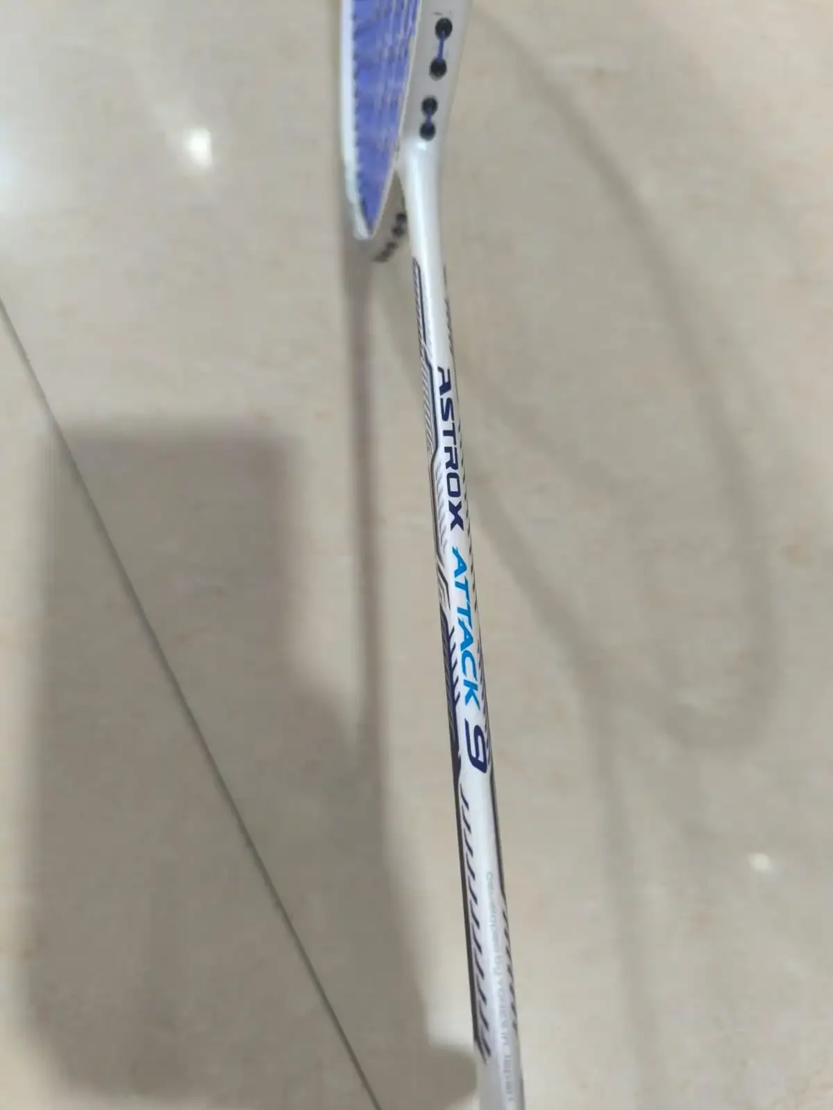 Close-up of Yonex Astrox Attack 9 shaft graphics
